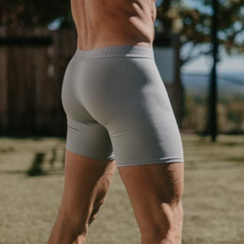 Man standing, facing away from the camera in a NADS Gray Organic Cotton Boxer Brief. 